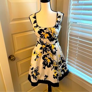 Rue21|| Yellow/black/ white floral party dress with pockets.
